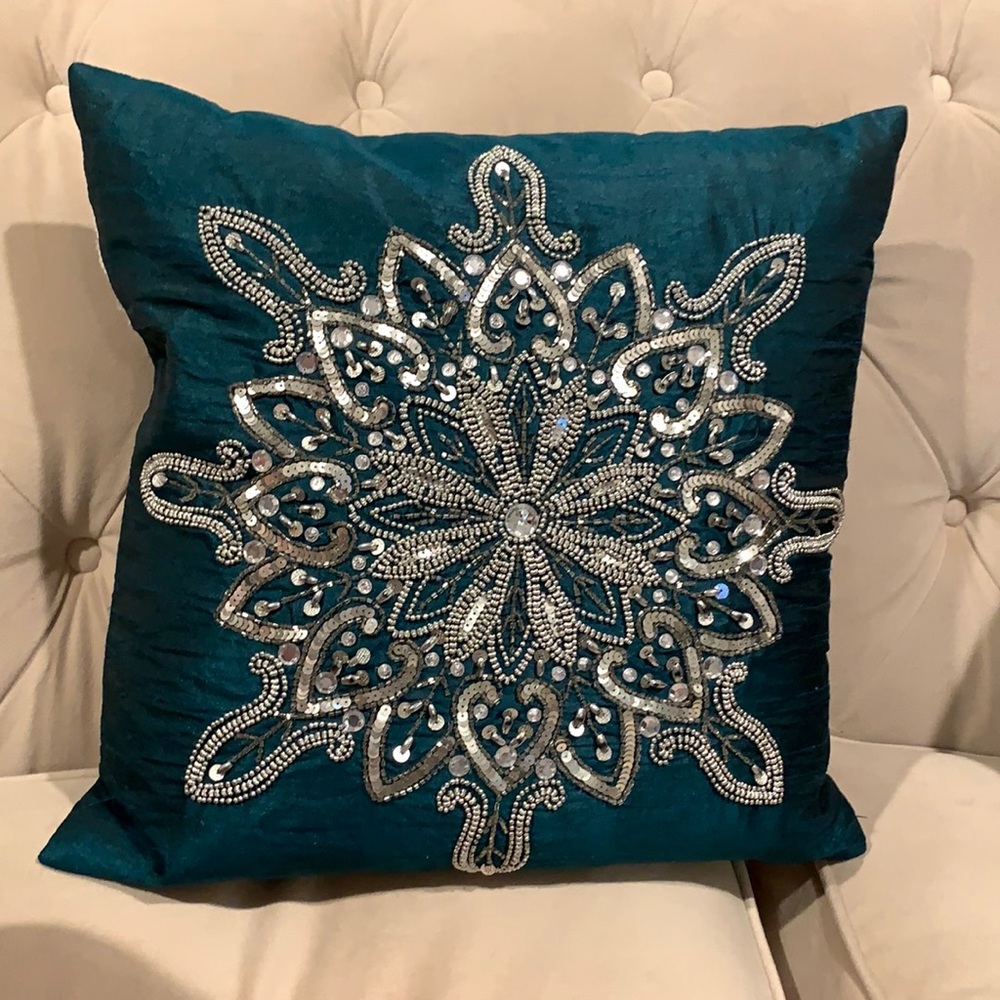 Beautiful teal sequenced pillow.